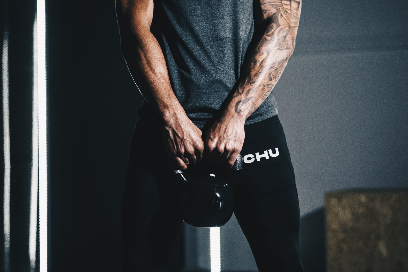 Man holding a dumbbell with both hands